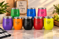 12oz wine tumblers in 8 colors including purple, orange, black, red, yellow, green, blue, and pink with engraved chef logo